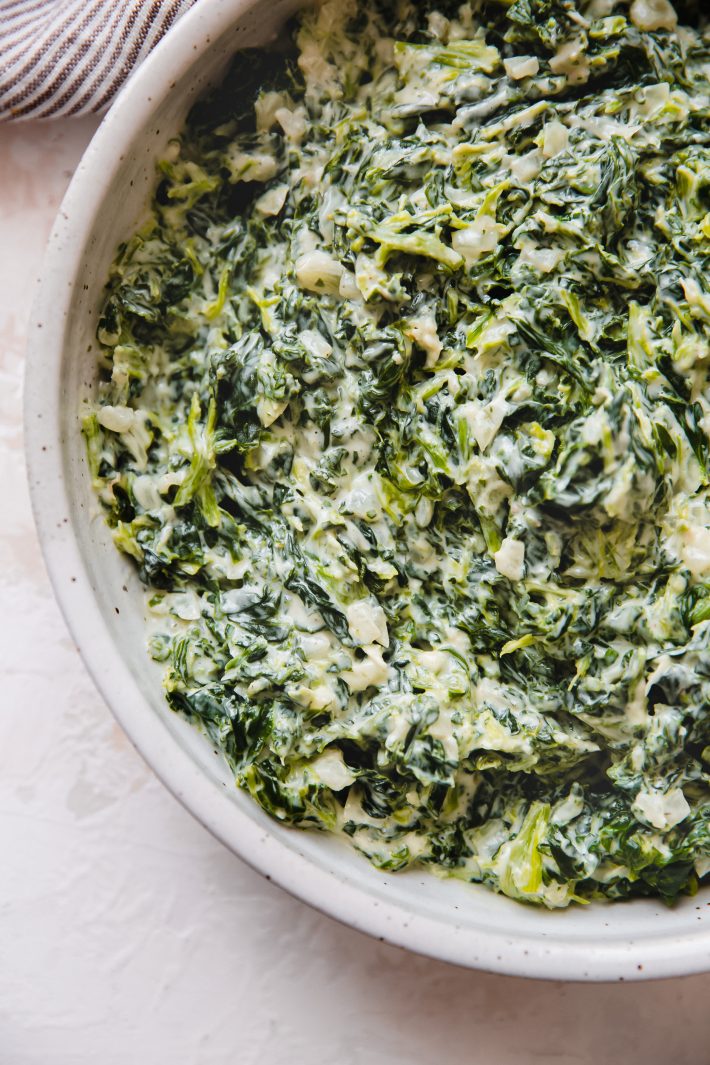 close up of creamed spinach in bowl
