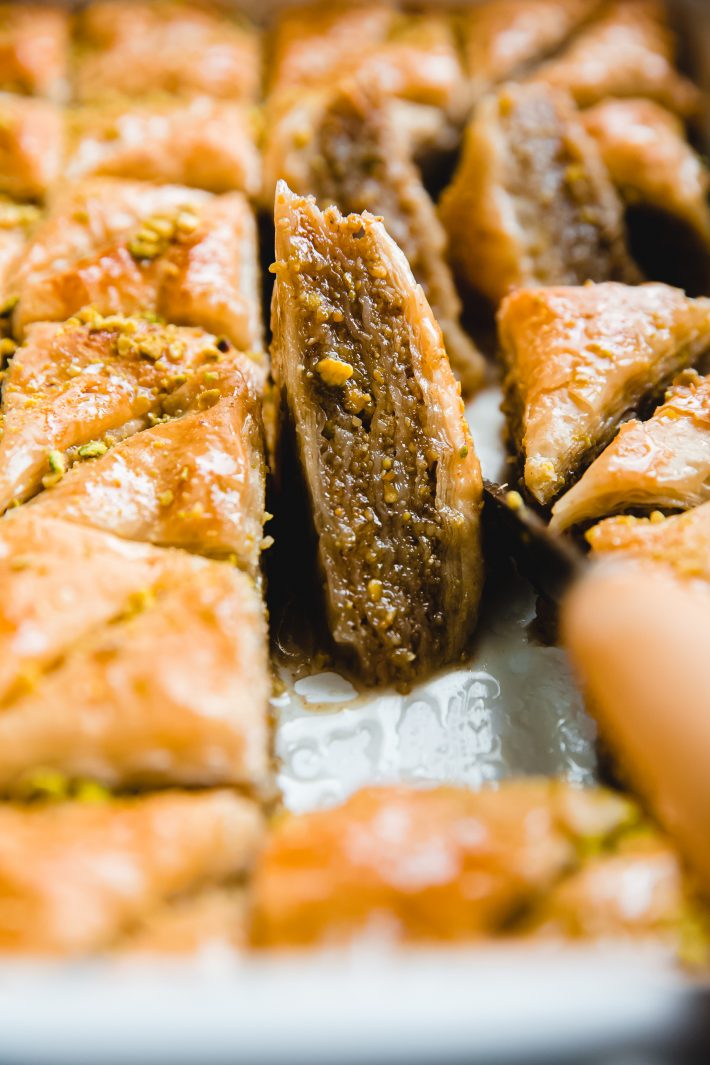 baklava square in baking dish with knife