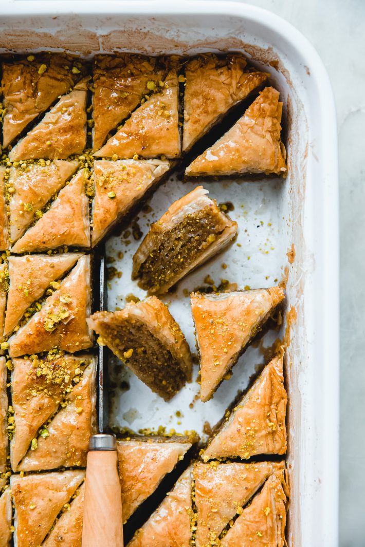 baklava pieces in dish with knife