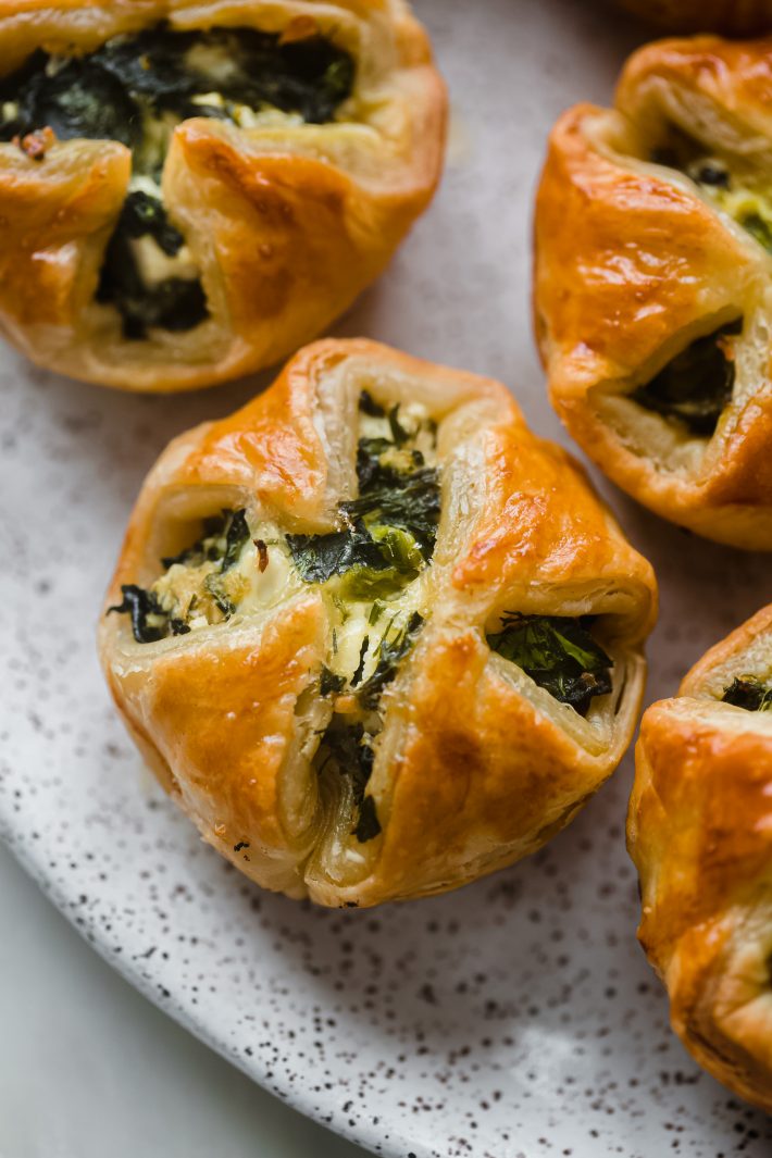 spinach puffs on speckled plate