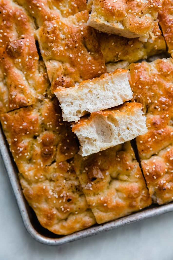 two pieces of focaccia showing texture