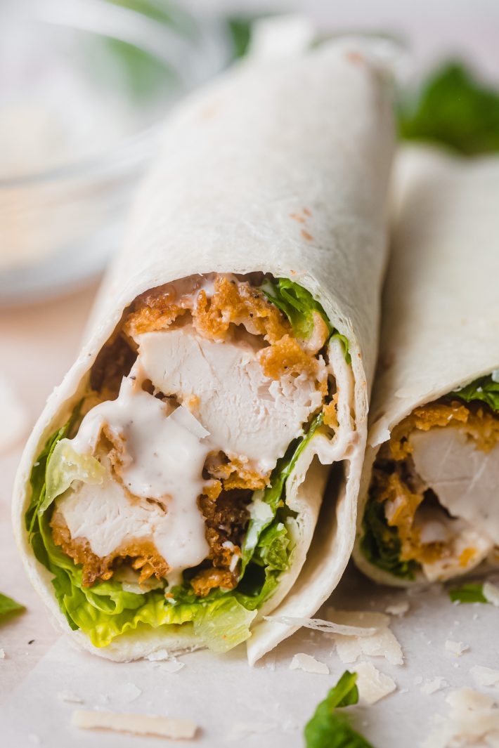chicken caesar wrapped sliced on parchment
