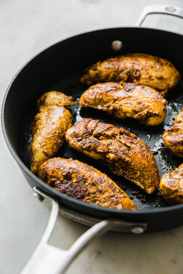 seasoned chicken tenders cooked in a pan