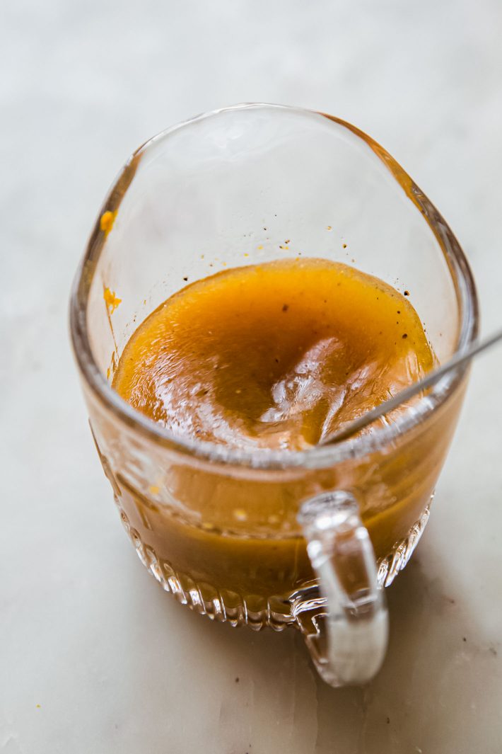 citrus vinaigrette in glass measuring cup