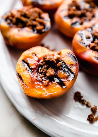 grilled peaches topped with cookie crumble