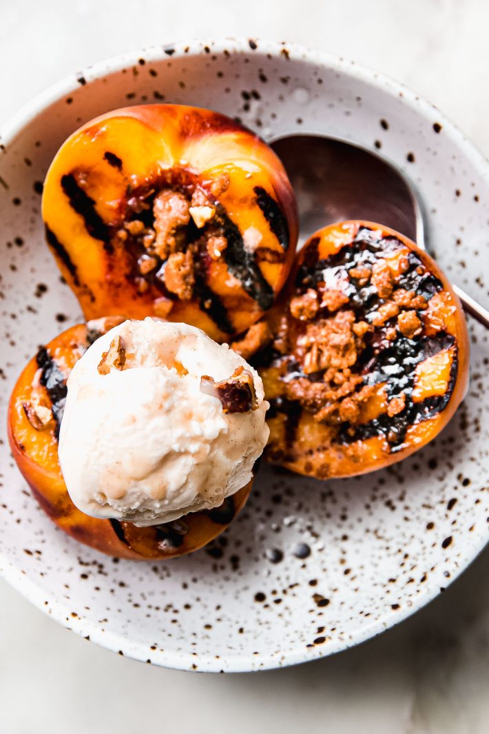 seared peaches drizzled with cinnamon butter topped with  ice cream