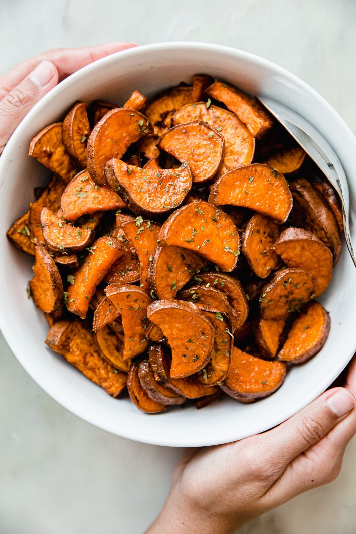 sweet potatoes after roasting in bowl with spoon