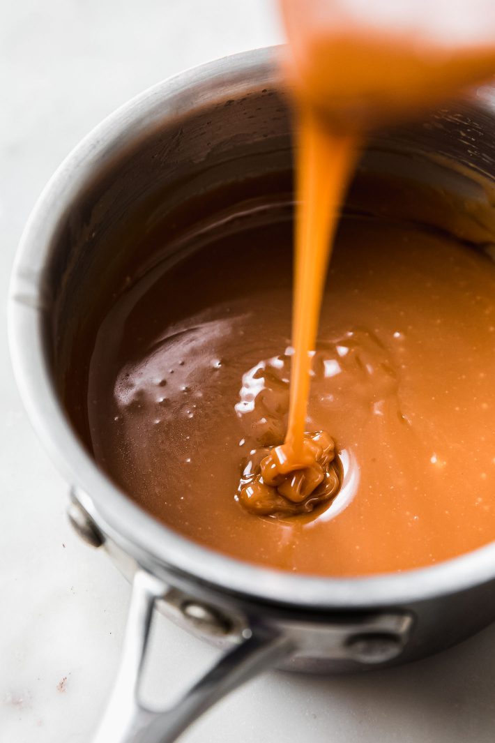 melted soft caramel chews in sauce pan drizzled from spatula