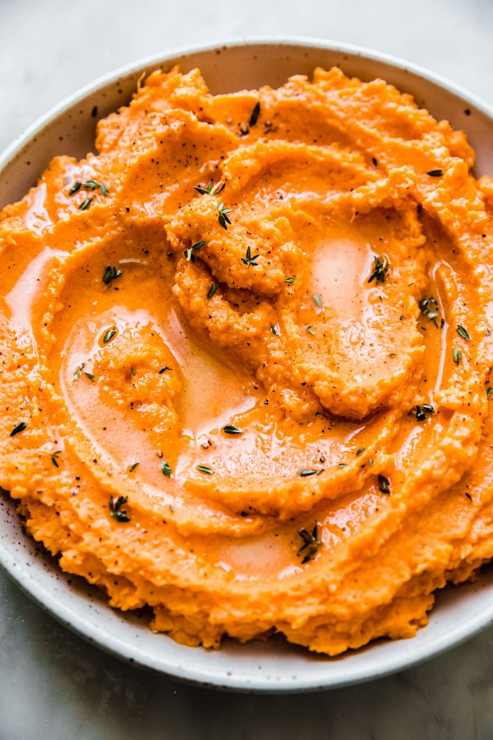 mashed sweet potatoes with butter and fresh thyme