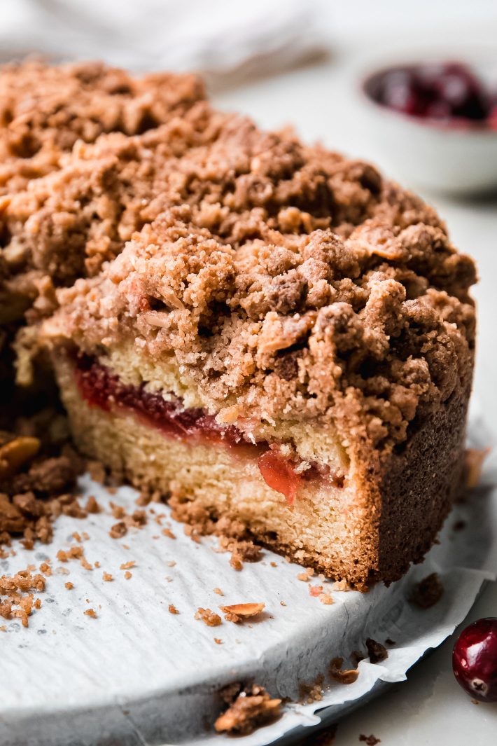 sliced cranberry sauce coffee cake showing cranberry layer