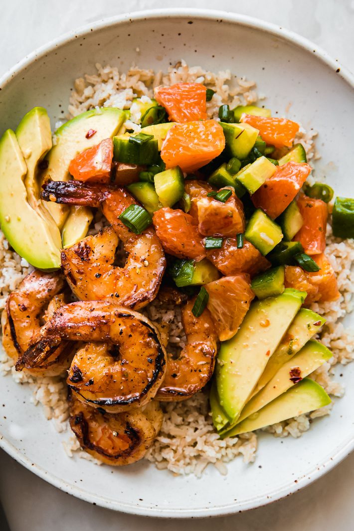 shrimp over rice with salad and avocados
