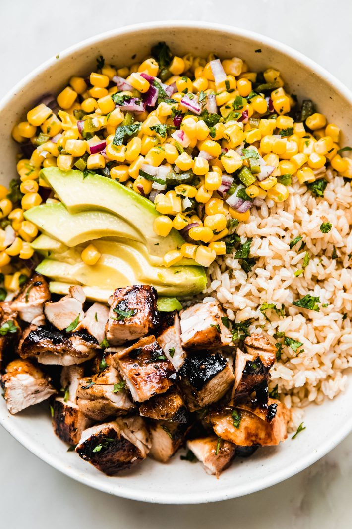 honey chipotle chicken bowls with brown rice, avocados, and corn salsa