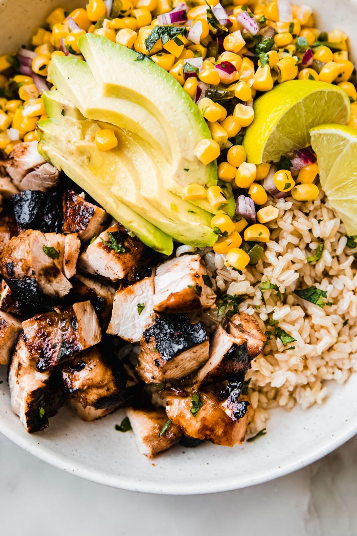 chipotle chicken, rice avocados and corn salsa in bowl