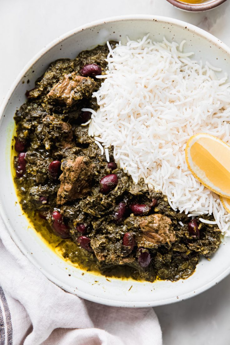 ghormeh sabzi on plate with lemon and basmati rice
