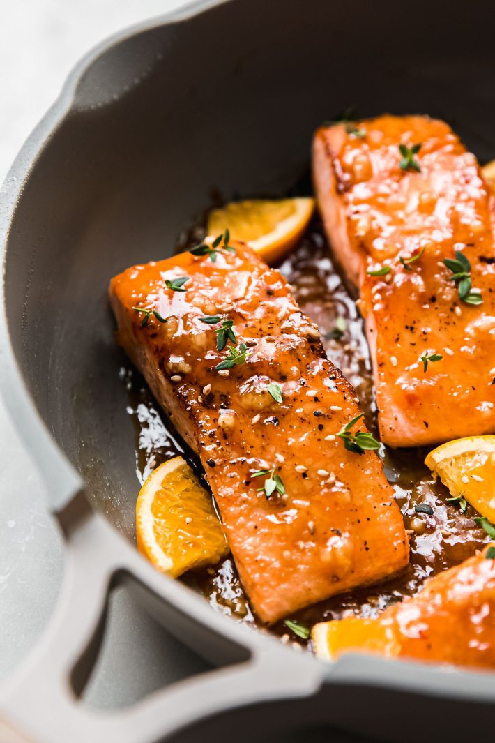 orange glazed salmon in pan