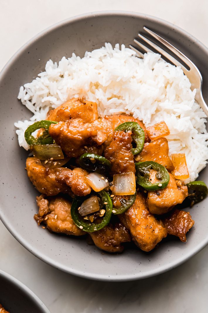 jalapeno chicken on plate with rice and fork