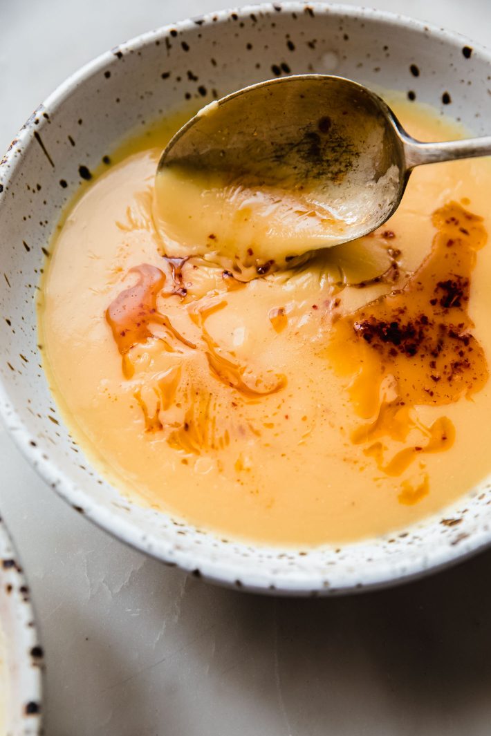 turkish red lentil soup on spoon
