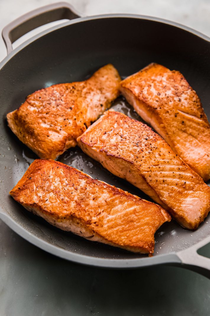 pan seared salmon filets in pan