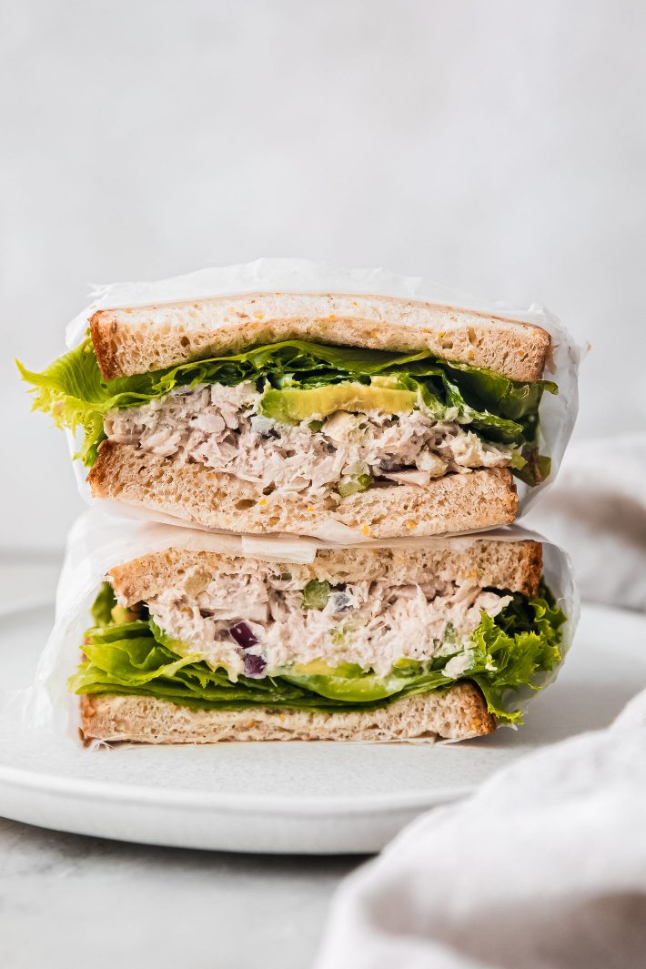 tuna salad sandwich halves on plate stacked