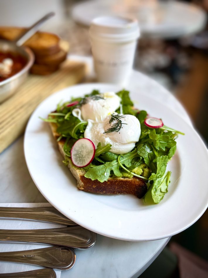 avocado toast with poached eggs at tatte bakery