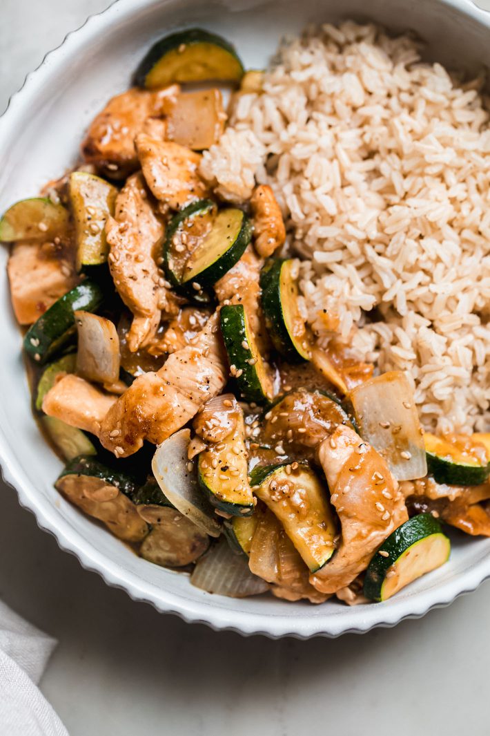 stir fry topped with sesame seeds with brown rice