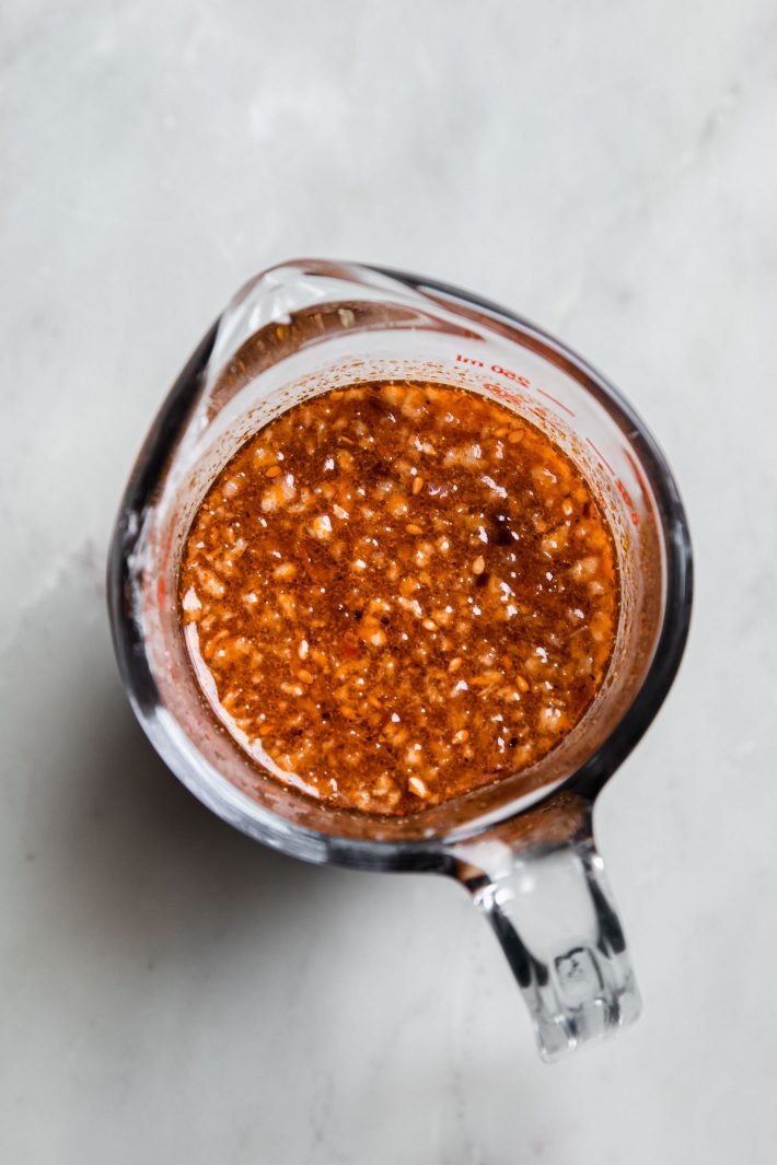 chili crisp ponzu sauce in measuring cup